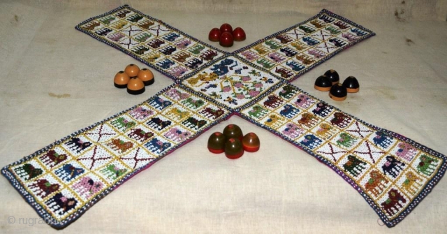 A unique and very fine Chaupar (Indian game, played with 4 players, somewhat like LUDO game), made from tiny glass beads intricately weave on cotton cloth, with Manchester printed cotton cloth behind.  ...