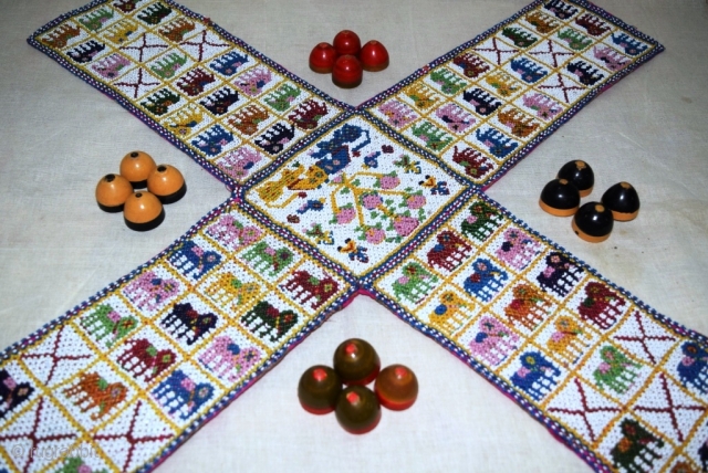 A unique and very fine Chaupar (Indian game, played with 4 players, somewhat like LUDO game), made from tiny glass beads intricately weave on cotton cloth, with Manchester printed cotton cloth behind.  ...