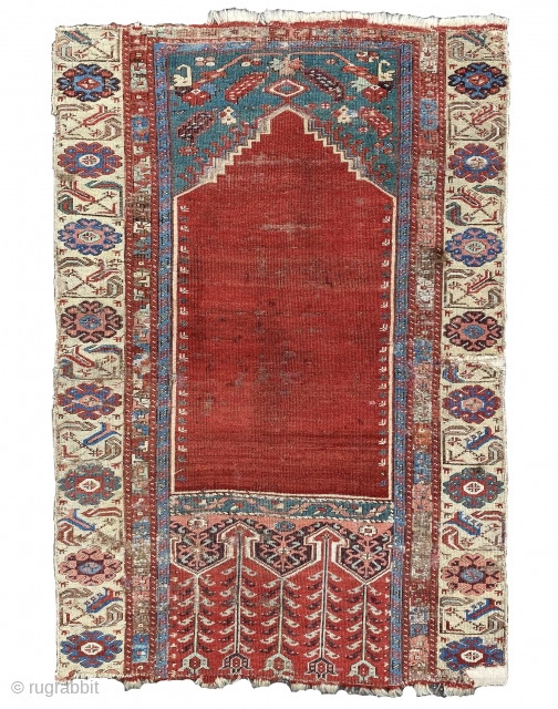 This old prayer rug belongs to the Ladik group with a mihrab niche, these carpets are also frequently referred to as “Tulip Ladik” on the grounds of their stylised tulips in the  ...