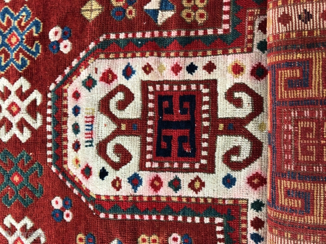 Pretty little Sewan Kazak.
Dated 1311? Sides and ends need some work, but all there. Great borders and colors, though red at one end is a little iffy. Size: 3ft x 5.5ft
Contact me  ...