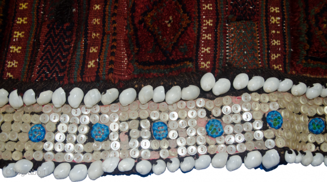 Charming antique Kurdish Saddlebag from the West of Iran.  The lustrous soft wool has been dyed using natural dyes and all the locks are intact. The button and shell decoration with  ...