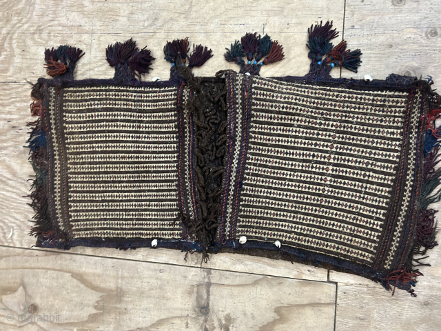 Antique Baluch/ Kelat saddlebag. The face is in very good condition the backing has a few small holes but a very good price. 122x55cm         