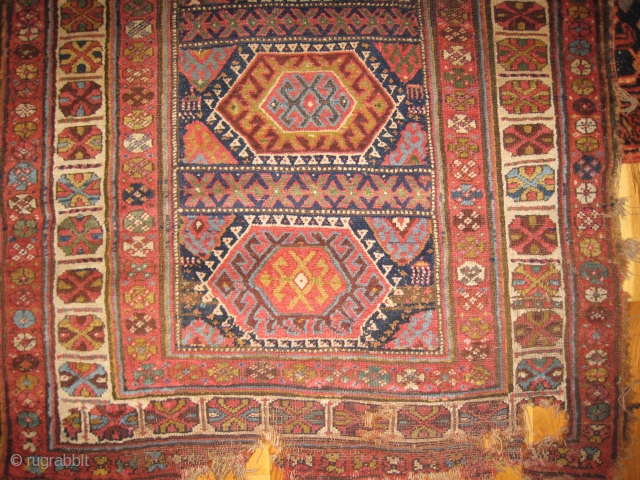 An uncommon Kurdish Long Rug with 11 or so medallions.                       