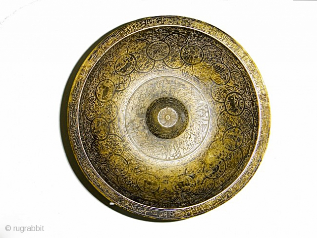 A SAFAVID BRASS MAGIC BOWL IRAN , 17TH CENTURY
Of typical form, the exterior finely engraved with cartouches with the signs of the Zodiac against a ground of magic numbers, the rim with  ...