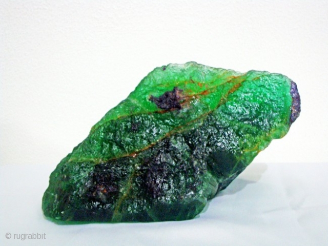 A beautiful large piece of green flourit stone extremly rare piece very clear and transparent . 2 kg               