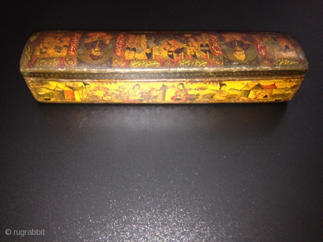 A POLYCHROME LACQUER PAPIER MÂCHÉ PEN CASE (QALAMDAN) QAJAR IRAN, 19TH CENTURY
With rounded ends and sliding tray, the top painted with a central cartouche depicting Nasir al-Din Shah with Persian poems enthroned  ...
