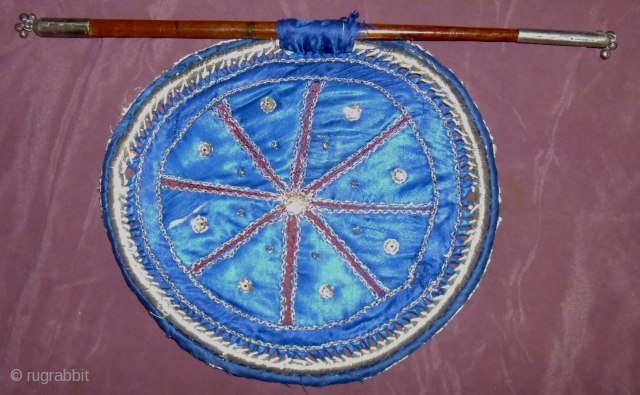 ITS A HAND FAN FROM WEST BENGAL USE BY THE ZAMIDARS IN 19th AND 20th CENTURY.SILVER THREADS ARE USED.IN THE TOP AND BOTTOM OF THE STICK SILVER IS USED.THE WORK IS BEEN  ...