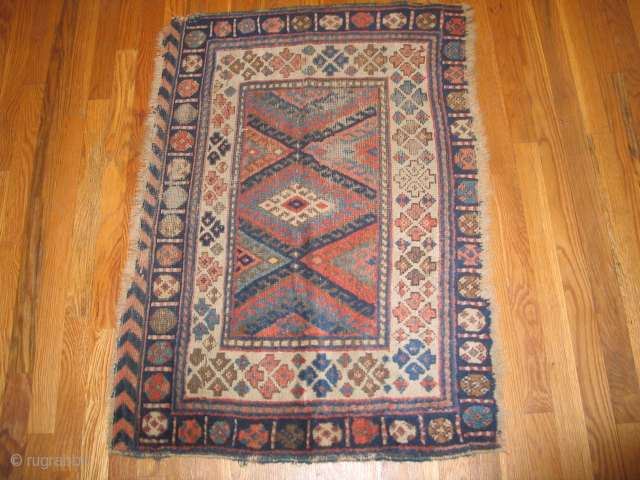 . Kurdish. It measures 2'5" x 3'6"  with some worn areas of low pile.                  