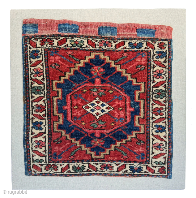 Antique Heriz bag face, circa 1900, that has been sewn onto a hessian wrapped wooden frame, which can be hung on a wall as a piece of rug art.

The size of the  ...