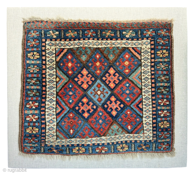 Late 19th century Kurdish Jaf bag face, that has been sewn onto a hessian wrapped wooden frame.   This can be hung on a wall as a piece of rug art.

The  ...