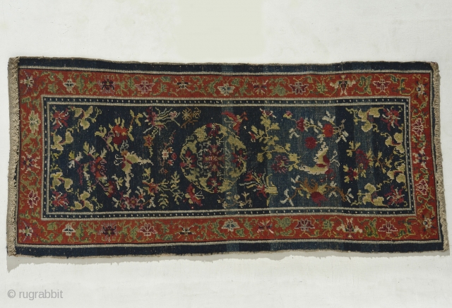 Tibet – Mid 19th century, unusually well made incorporating ½ and ¼ knots.  
Lots of Chinese influence.  Measures 154cm x 68cm.  All natural colors.  
    