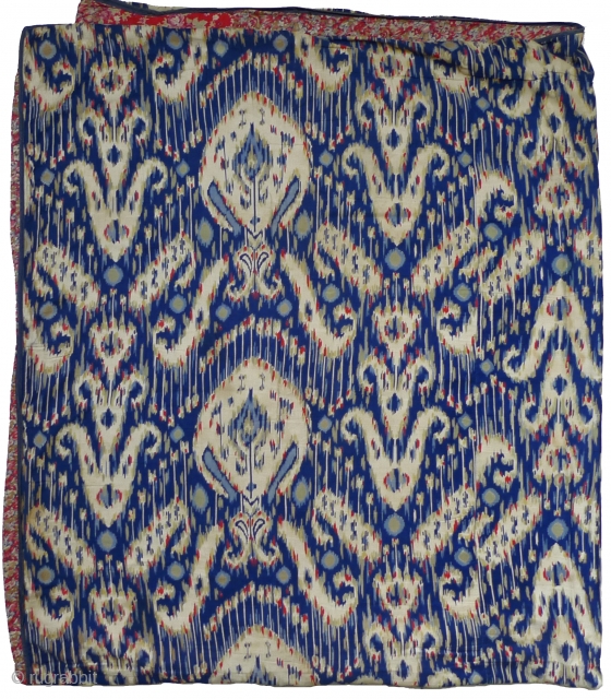 Faux-Ikat Quilt ("Kurpa"). Uzbekistan, circa 1970s. 78" high x 69" wide. Three joined lengths of printed cotton faux-ikat - each 28"x78"(selvedge to selvedge); 27.5"x78"; 13.5"x72". 16" repeat. (The entire length of cloth  ...