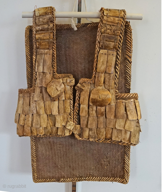 Indonesian warrior Vest from the Toraja people of Sulawesi Island.   Made from water buffalo bone, and sewn together with woven rattan plant fibers. the vest makes great wall display. mid-20th  ...