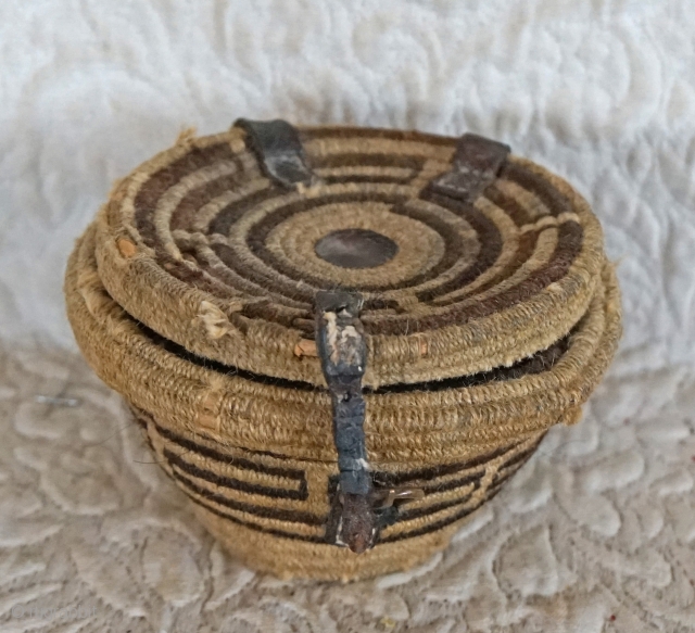 Antique Tibetan woven bowl container.

This woven Tibetan container was used to hold a pair of wooden tea bowls. There is a removable interior separator which allows for the separation of the tea  ...