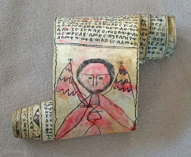 This is a traditional Antique Coptic Christian scroll from the Oromo people of Ethiopia. Painted on Vellum (processed animal skin) and using a special black and red ink, the text is in  ...