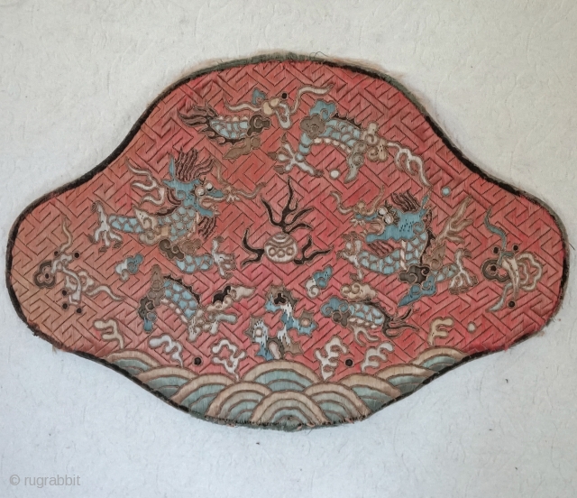 Tradition Lotus shaped Chinese silk pillow....
Fret pattern Embroidered background with dragons and other creatures using both satin stitch and couching with gold metallic covered thread.... Some fading and some wear around the  ...