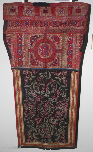 Rare old Shui ethnic minority baby carrier is from Gui Zhou province China. The upper section is elaborately embroidered using mostly satin stitch technique. The lower section is embroidered with a horsehair  ...