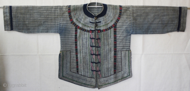 EMT #150   This was the traditional jacket used by girls of the Yi Chinese ethnic Minority. Girls wore this style until they were married. This garment is small and was  ...