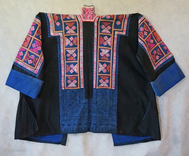 Made by a women of the Miao minority often referred to as the "tiny Miao" ...not because of their stature but because they were recognized for their "tiny" embroidery stitches... This jacket  ...