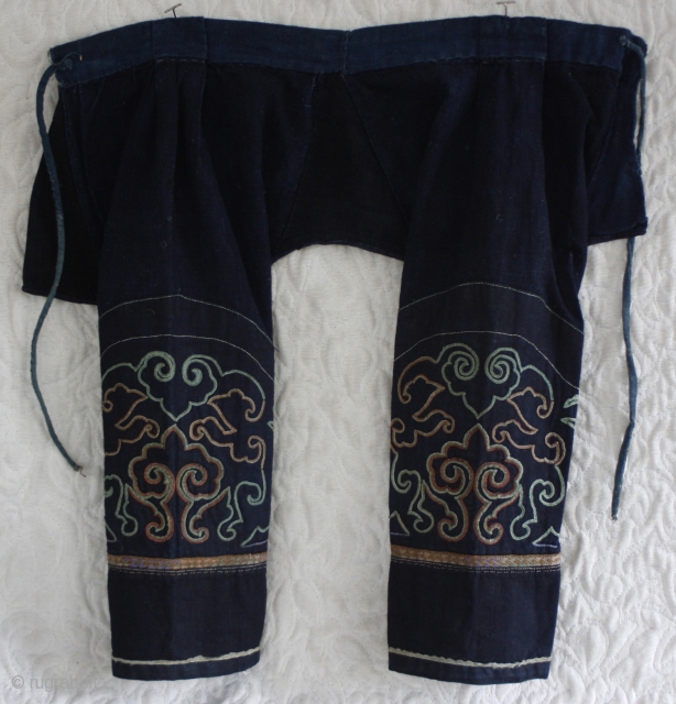 Miao Chinese minority toddlers pants circa 1940's
EMT160
These toddler's pants were used by successive siblings and probably several generations of Chinese Miao ethnic minority children. The pants are of handwoven indigo dyed fabric  ...