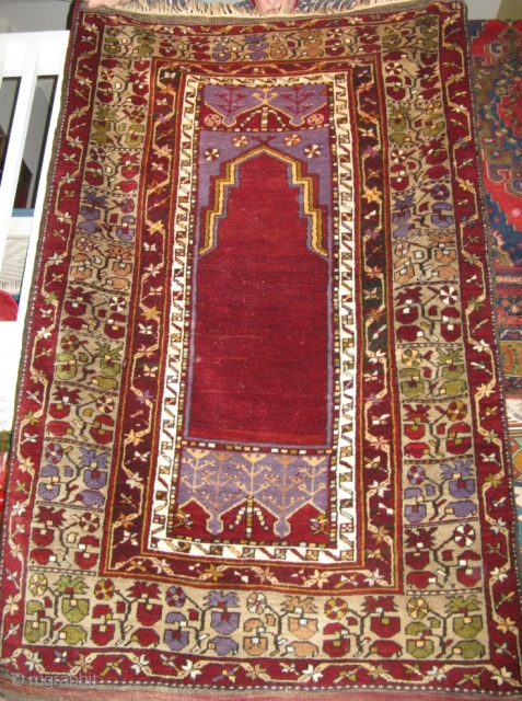 Maden(Turkey)Prayer Rug 1900-1910
From the hills above Diyarbakir, with it's own variation on Turkish tulips, this 4 x 6 full pile rug has cochineal and geranium (Kurdish) in the dyes casting cool blues  ...