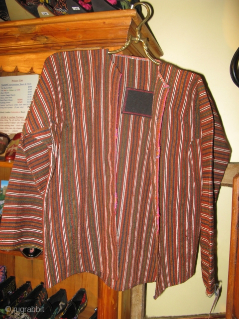 Anatolian Boy's hand woven wool jacket Circa 1910 -30.
One repair (mine) (shown). Excellent condition.
The wool may have been carpet wool as it is a wee bit rough.      