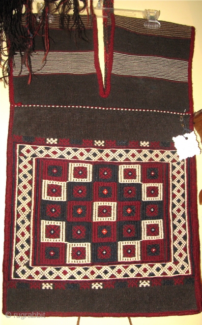 Bergama Heybe 1st half 20th C 
Classic Bergama in dowery trunk condition.
Minor mended holes on the back. Ground is black goat hair,
the embroidery is hand spun dark red and white wool.
Typical Bergama  ...