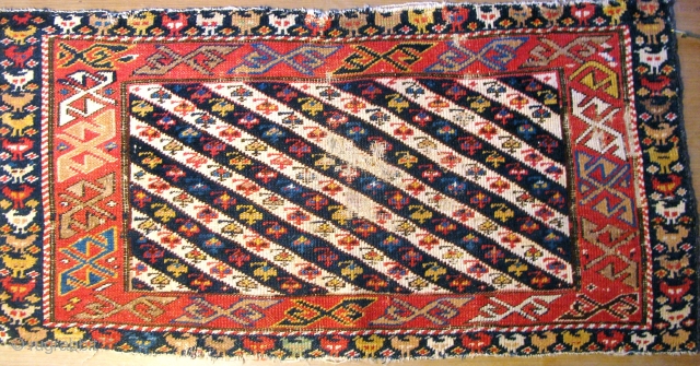 Re-posted: Caucasian Shirvan Long bagface
fragment circa 1870s  Floppy hand. Amazing dark 
almost black blues have good pile,no faded colours
except the Fuchine which helps establish the age
The wool is wonderful and so  ...