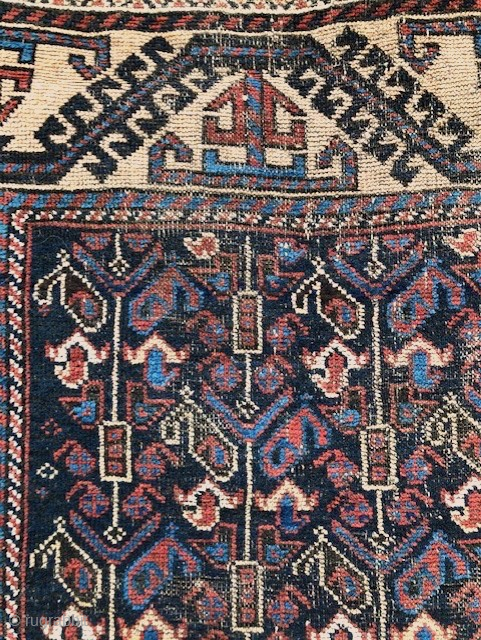 Antique 'Arab' Baluch rug, 3'4 x 6'4. Dramatic blue-black ground in field with design of vertical 'botheh' trees. Camel ground border. Natural dues with nice red and polychromatic blue. Machine selvedge added,  ...