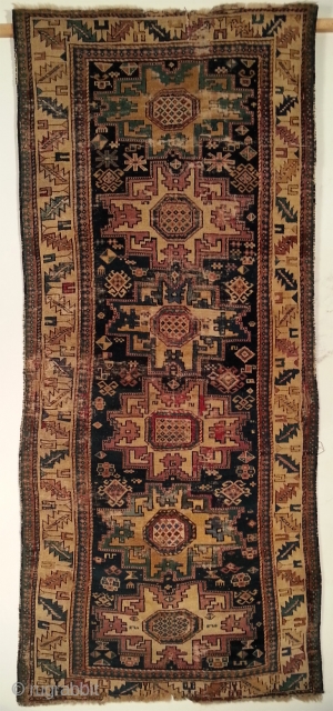East caucasian carpet with Leshgi stars, 19th.C. 110 x 209 cm. Some old repairs, cuts and partially very worn.              