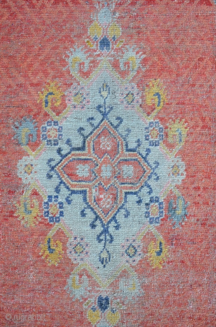 Exceptional West Anatolian Carpet with an Ushak type Medallion. The field is ornamented with different shades of apricot. Some damages on the upper right side. 173 x 106 cm    