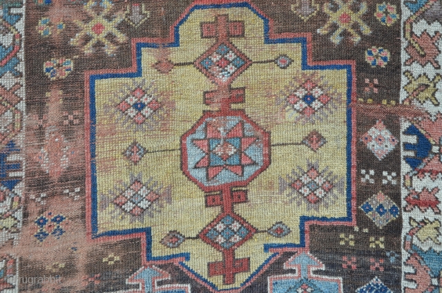 Caucasian long rug 317 x 104 cm, great colors including tomato red, aubergine and one camel ground medallion, archaic patterns.             