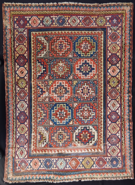 Caucasian Carpet with Memling Göl, probably a Gendje? Wide range of colors incl. aubergine, pink, light blue, petrol. Several old (not so good) repairs and some little holes and damages. As found  ...