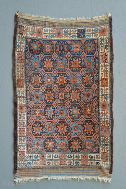 Antique Star Baluch in 100% original condition. Original kilim ends and selvages. Full pile. Includes bottle green dye. Unwashed. I could not find anything similar in the literature.     