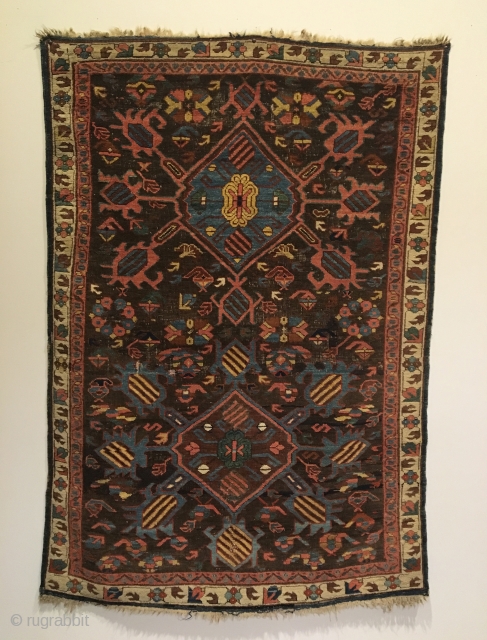 Kuba bird rug. 1st half 19th Century.  Two medallions on purple brown field, radiating birds with Marasali type striping.  Note three Seychour cabbage heads floating below upper medallion. Attractive floral  ...