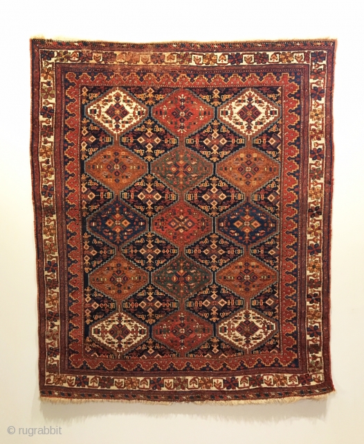 Antique Afshar Rug.  4th Quarter 19th Century.  Intriguing vertical stepped medallions on dark blue field.  Deeply saturated colors and lanolin-rich wool.  Very good condition.  All sides original.  ...