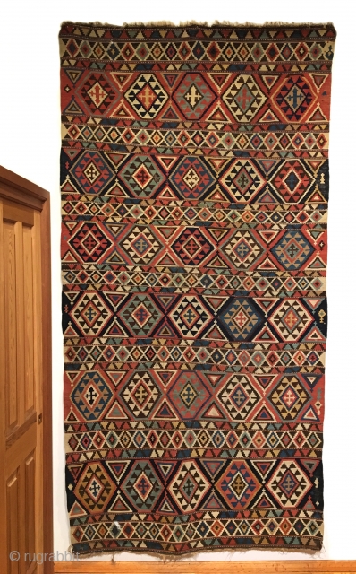 Shirvan Kilim. 2nd Half 19th Century. A very colorful and finely woven early kilim. 6 x 5 large hexagonal rows are separated by cross tipped triangles. 7 Horizontal bands contain stepped diamonds.  ...