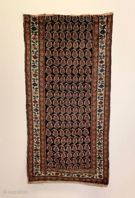 Antique Persian Kurdish Runner. Circa 1910. Alternating rows of glowing boteh sit on a soft-silky indigo field. The boteh drawing and spacing is random suggesting it was woven in a tribal environment.  ...