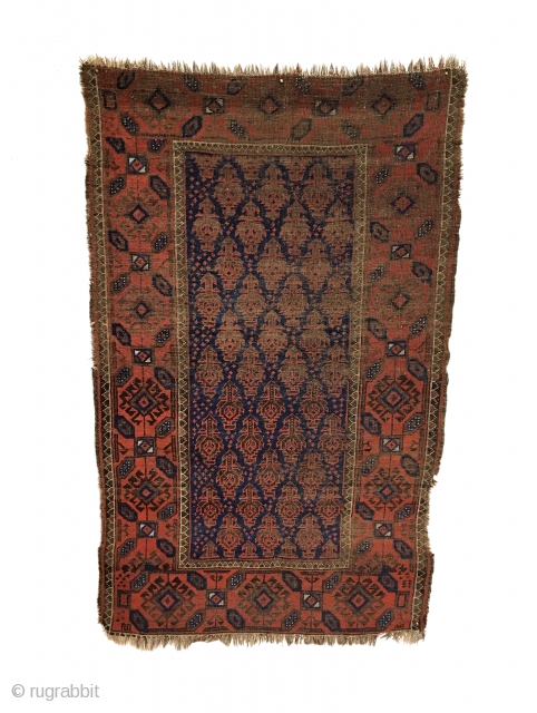 Antique Baluch Rug. North East Persia. Mid 19th Century. Deep blue field covered with Dokhtar-I-Ghazi bird trees. A main border of intermittent octagons enclosing bird head diamonds, associated with earlier rugs. Great  ...