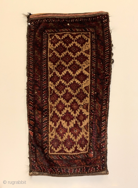 Antique Baluchi Tribal Cushion (Balisht). Northeast Persia. Stepped purple pendants on camel field. Full pile in original condition. 5 colors. 2’7” x 1’4”. Delicately hand washed.

See Christie’s East, Sept. 1990: J.P.J Homer  ...