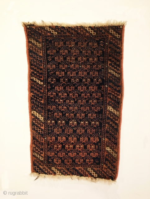 Antique Timuri Baluch Balisht. Circa 1900. Botehs sit on dark blue field. Great condition. Finely woven and reselvaged. 7 colors. 2’7” x 1’7”. Delicately hand washed.  
     