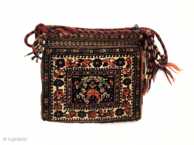 Antique Afshar Chanteh. Early 20th Century. Rare and fully intact small bag. A tribal treasure. Chevron kilim back. Mint condition considering age. Original sides. 7 colors. 1’0” x 1’1”. Carefully hand washed. 