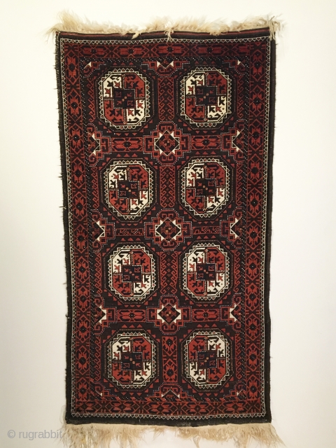 Salar Khani Baluch Rug.  North-east Persia.  Circa 1880. Turkmen gols float on a madder and slightly corroded embossed brown field.  Mint condition.  5 colors.  67 x 35.  ...