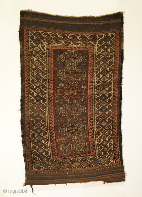 Baluch Rug. Symmetrically knotted group. Hooked medallions float on madder field surrounded by bird pinwheel border.  Last Quarter 19th Century.  Beautiful kilim ends.  6 colors.  51 x 31.5.  ...