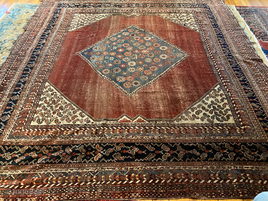 11’4” x 9’10” Antique Quashqi Boteh Main Rug [130] 
Antique Quashqi main carpet. With 16 borders, this piece features an abrashed cranberry field and ivory boteh filled corner brackets. In great condition,  ...