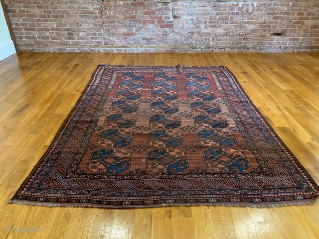 Antique Ersari Main Carpet. Late 19th Century. The field is arranged with a 3x7 row format of Gulli Gols that vary in size. Of special note is the three shades of abrash  ...