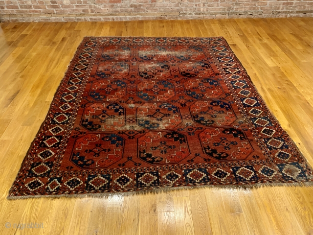 Antique Ersari Nomadic Main Carpet. Mid 19th Century. 15 large octagonal guls in blue and orange float on glowing madder red field. Star tipped diamond gols within main gul are also woven  ...