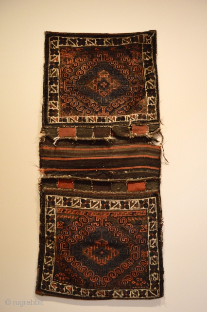 Baluchi Saddle Bags.

Mushwani Design Group - NW Afghanistan.

Last Quarter 19th Century.  Soft, shiny wool.  Saturated Colors.  28in x 63in. 

Clean and hand washed.

Note: Interesting field variations and brown corrosion.  ...