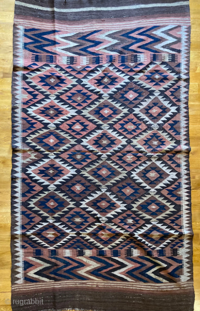10'5" x 5'10" Antique Maimana Northern Afghan Kilim [005]

Circa 1920, this piece is perfect for a bedroom, an office, or on a wall as a decorative piece. Chevron border bracketed with serrated  ...