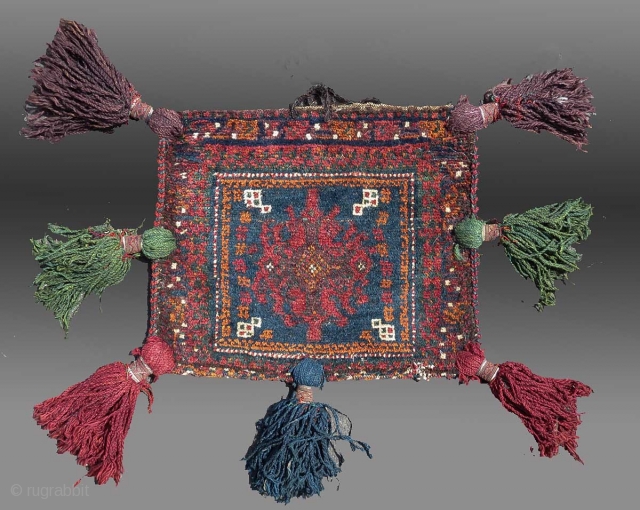 Baluch "Chanteh" (personal bag), SE Persia, circa 1900 or before, 1'5" x 1'2'

Signs of use, the back (detail showing the knots from the reverse side) exhibits 'patina' or signs of usage over  ...